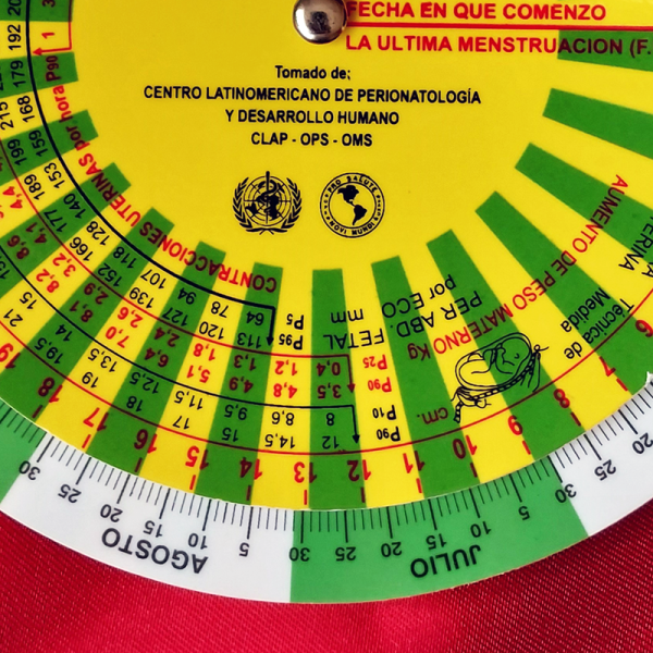 Detalle del Gestograma de Bolsillo CLAP – Primer plano del disco móvil y las escalas de cálculo de edad gestacional, peso fetal y altura uterina. Herramienta médica precisa.