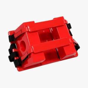 Inmovilizador de cabeza para camilla rígida de emergencia, color rojo, con soportes laterales, correas de velcro y base para inmovilización cervical durante el traslado de pacientes.